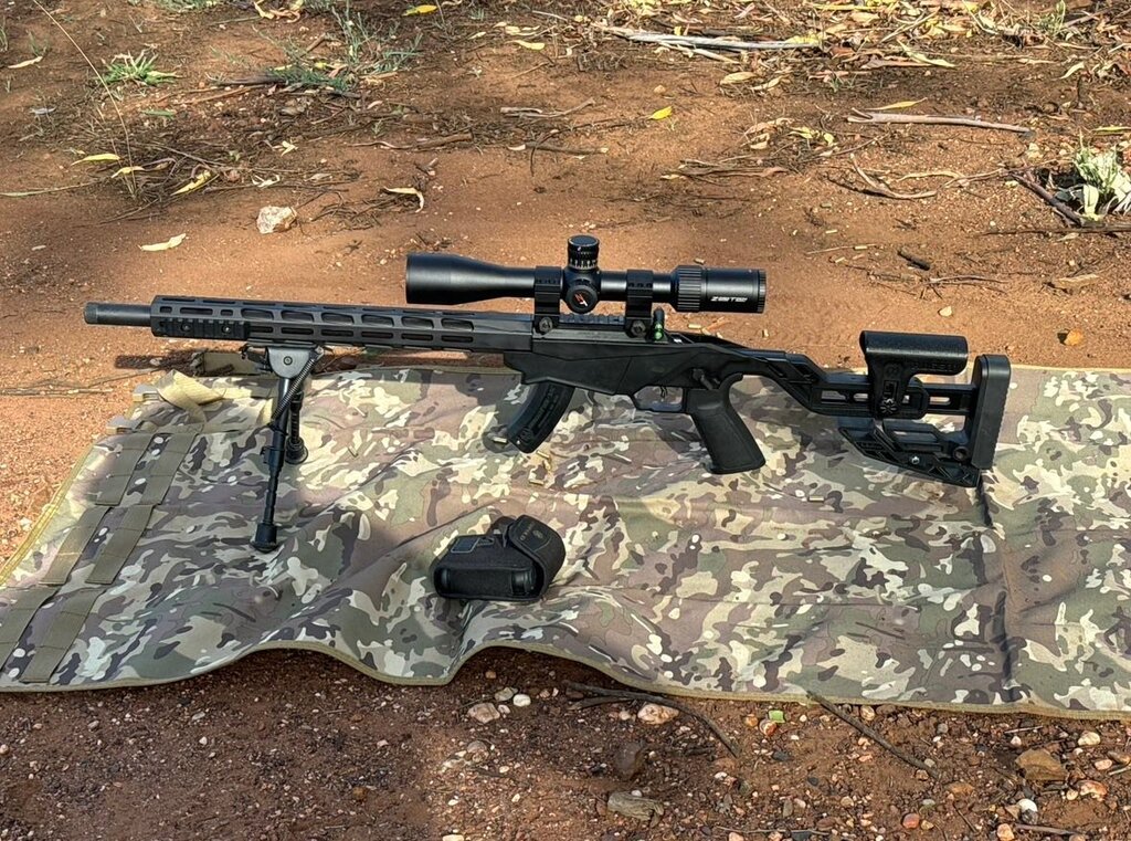 Rifle prepared on field mat for pest control in rural NSW
